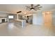 Spacious living room with large island, stainless steel appliances, tile flooring, and modern lighting at 2402 16Th W St, Palmetto, FL 34221