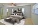 Serene main bedroom featuring a ceiling fan, ample natural light, and neutral decor for a relaxing retreat at 2402 16Th W St, Palmetto, FL 34221