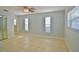 Airy main bedroom with natural light, tile flooring and a closet for organizing your belongings at 2402 16Th W St, Palmetto, FL 34221