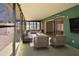 Comfortable sunroom with modern furniture and sliding glass doors at 2402 16Th W St, Palmetto, FL 34221
