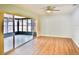 Bright sunroom with sliding glass doors and hardwood floors at 2402 16Th W St, Palmetto, FL 34221