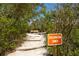 Wooded path to the observation tower with wooden steps and lush trees at 2402 16Th W St, Palmetto, FL 34221