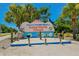 A welcome sign for Holmes Beach on Anna Maria Island is surrounded by palm trees and landscaping at 2402 16Th W St, Palmetto, FL 34221