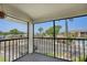 Relax on this balcony with views of mature landscaping, the pool, and neighborhood at 2415 Bayshore Gardens Pkwy # 8, Bradenton, FL 34207