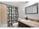 Updated bathroom with modern black hardware and a shower-tub combo at 2415 Bayshore Gardens Pkwy # 8, Bradenton, FL 34207