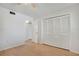 Bedroom features laminate wood floor and a large closet at 2415 Bayshore Gardens Pkwy # 8, Bradenton, FL 34207