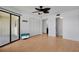 Bedroom with laminate wood floor, ceiling fan and sliding glass doors to porch at 2415 Bayshore Gardens Pkwy # 8, Bradenton, FL 34207