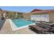 Inviting community pool with lounge chairs, surrounded by well-maintained landscaping, offering a relaxing outdoor space at 2415 Bayshore Gardens Pkwy # 8, Bradenton, FL 34207