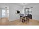 Dining area featuring stylish light fixture, with a glass table and four decorative chairs at 2415 Bayshore Gardens Pkwy # 8, Bradenton, FL 34207