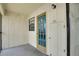 Front door with decorative window in covered entryway at 2415 Bayshore Gardens Pkwy # 8, Bradenton, FL 34207