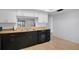 Bright kitchen showcasing ample counter space, a stainless steel sink, and black appliances for a modern touch at 2415 Bayshore Gardens Pkwy # 8, Bradenton, FL 34207