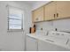 Convenient laundry area with window, providing functionality and natural light to this utility space at 2415 Bayshore Gardens Pkwy # 8, Bradenton, FL 34207