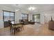 Spacious living room featuring modern lighting and an attached dining area at 2415 Bayshore Gardens Pkwy # 8, Bradenton, FL 34207
