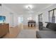 View of the living room into dining and kitchen areas with ample light at 2415 Bayshore Gardens Pkwy # 8, Bradenton, FL 34207