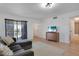 Cozy living room with sliding glass doors to the outside and a TV stand at 2415 Bayshore Gardens Pkwy # 8, Bradenton, FL 34207
