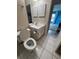 Updated bathroom features neutral colors, tiled floor, and a mirrored wall cabinet at 2808 60Th W Ave # 1924, Bradenton, FL 34207