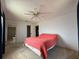Bright bedroom features neutral carpeting and a ceiling fan at 2808 60Th W Ave # 1924, Bradenton, FL 34207