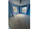 Bright bedroom with two windows, plush carpeting, and a ceiling fan for added comfort at 2808 60Th W Ave # 1924, Bradenton, FL 34207