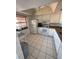 Bright kitchen features a ceiling fan and plentiful cabinet space at 2808 60Th W Ave # 1924, Bradenton, FL 34207