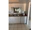 Double sink view in the bright kitchen with white cabinets at 2808 60Th W Ave # 1924, Bradenton, FL 34207