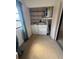 Convenient laundry area with washer, dryer, shelving, and natural light at 2808 60Th W Ave # 1924, Bradenton, FL 34207