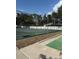 A well-maintained tennis court enclosed by chain link fence at 2808 60Th W Ave # 1924, Bradenton, FL 34207