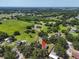 Aerial view of the property with large lot, mature trees, and tranquil setting at 3021 Leila Estelle Dr, Plant City, FL 33565