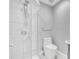 Modern bathroom featuring a glass door shower with dual showerheads and a white toilet at 3021 Leila Estelle Dr, Plant City, FL 33565