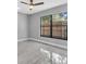 Bright bedroom with ample natural light showcases neutral walls and modern flooring at 3021 Leila Estelle Dr, Plant City, FL 33565