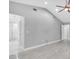 Large bedroom with high ceilings, tile floors and an ensuite bathroom with a large shower at 3021 Leila Estelle Dr, Plant City, FL 33565