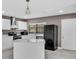 Bright kitchen with white cabinets, stainless steel appliances, and center island at 3021 Leila Estelle Dr, Plant City, FL 33565