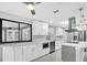 Bright kitchen featuring stainless steel appliances, island, and a view to the pool area at 3021 Leila Estelle Dr, Plant City, FL 33565