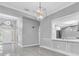 Open-concept living area with stylish lighting and a kitchen pass-through at 3021 Leila Estelle Dr, Plant City, FL 33565