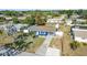 Overhead shot of a house, displaying the well-maintained yard, landscaped garden and inviting entrance at 3095 Pinetree St, Port Charlotte, FL 33952