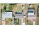 Birds-eye view of a property with pool, shed, and surrounding homes showing neighborhood layout and amenities at 3095 Pinetree St, Port Charlotte, FL 33952