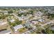 Aerial view of a neighborhood featuring single-Gathering homes, showcasing the layout, landscaping, and community at 3095 Pinetree St, Port Charlotte, FL 33952