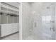 Luxurious bathroom boasting a glass-enclosed shower and custom closet with abundant storage at 33 S Palm Ave # 1403, Sarasota, FL 34236