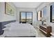 Bedroom featuring large windows with city views, stylish furnishings, and a serene atmosphere at 33 S Palm Ave # 1403, Sarasota, FL 34236