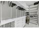 Spacious walk-in closet with custom shelving and ample space for storage and organization at 33 S Palm Ave # 1403, Sarasota, FL 34236