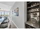 Stylish dining area with a built-in wine fridge and bar, open to the kitchen and living room at 33 S Palm Ave # 1403, Sarasota, FL 34236