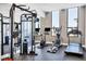 Well-equipped gym with modern weight machines, cardio equipment, and large windows for natural light at 33 S Palm Ave # 1403, Sarasota, FL 34236