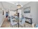 Open floor plan with kitchen and dining area featuring modern lighting and stainless appliances at 33 S Palm Ave # 1403, Sarasota, FL 34236
