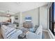 Open concept living room with beach views, stylish furnishings, and adjacent dining and kitchen areas at 33 S Palm Ave # 1403, Sarasota, FL 34236