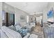 Open concept living room with beach views, stylish furnishings, and adjacent dining and kitchen areas at 33 S Palm Ave # 1403, Sarasota, FL 34236