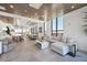 Bright living room with an open floor plan, tile floors, and large windows with skyline views at 33 S Palm Ave # 1403, Sarasota, FL 34236