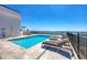 Rooftop pool with lounge chairs and stunning ocean views, offering a luxurious outdoor experience at 33 S Palm Ave # 1403, Sarasota, FL 34236