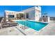 Relaxing rooftop pool features lounge chairs, a white pergola, and city views at 33 S Palm Ave # 1403, Sarasota, FL 34236