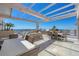 Outdoor roof deck with grilling station, dining areas, and comfortable seating overlooking a beautiful skyline at 33 S Palm Ave # 1403, Sarasota, FL 34236