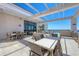 Rooftop deck with outdoor dining and lounge seating, plus grilling, and views of the city and the pool at 33 S Palm Ave # 1403, Sarasota, FL 34236