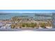 Expansive aerial view of the marina showcasing many boats and beautiful waterfront homes and scenery at 33 S Palm Ave # 1702, Sarasota, FL 34236